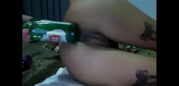  Brunette puts a beer in the ass